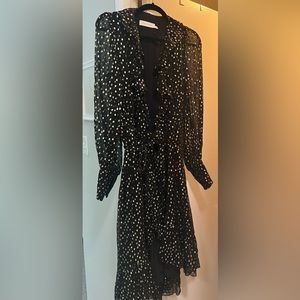 STUNNING ZIMMERMANN
Metallic polka-dot wrap dress.
